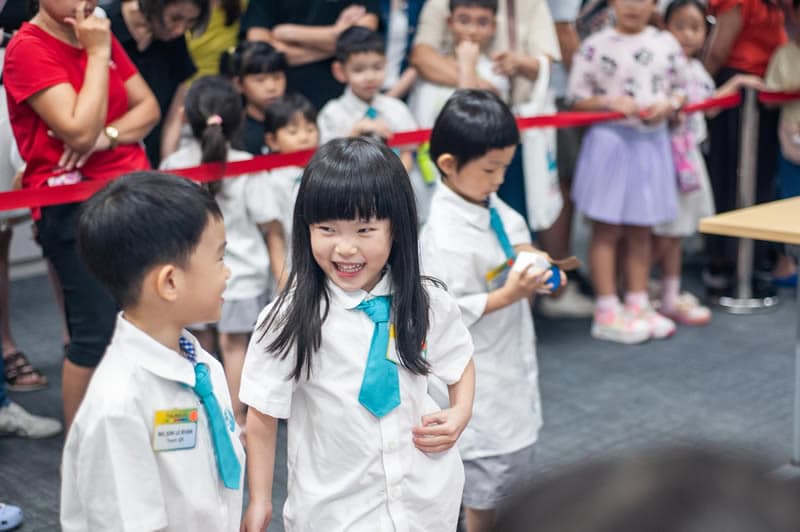 Children lined up for the ribbon-cutting moment