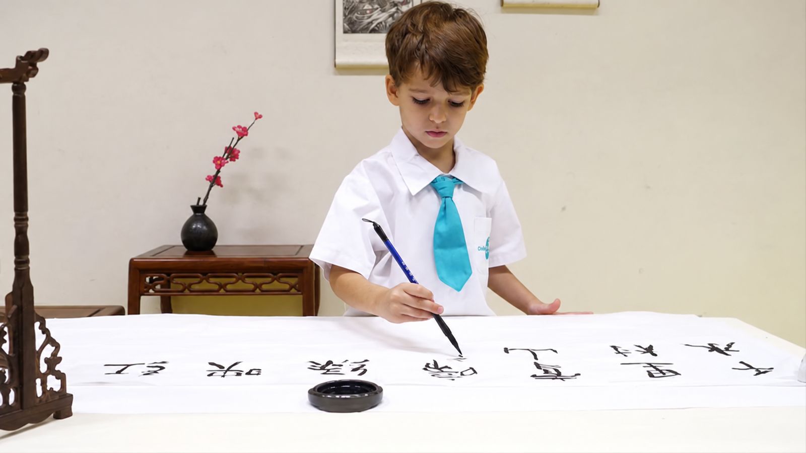 A child practising Chinese calligraphy